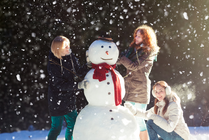 A snowman-building competition is a great holiday fundraising idea for schools.